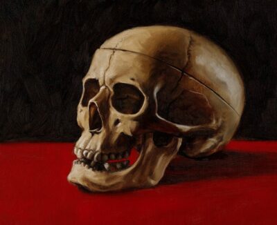 oil painting of human skull on red table